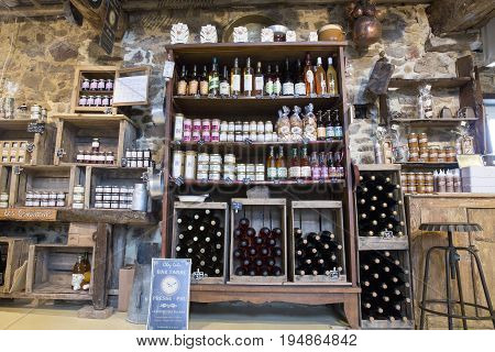 Valognes Normandy France - February 06 2014. Traditional typical delicatessen shop in Normandy. Shop of jams chutney alcohol biscuits pasta beer milk jam and retro products for decoration In wooden boxes