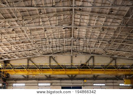 Ceiling of factory workshop with overhead crane
