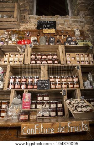 Valognes Normandy France - February 06 2014. Traditional typical delicatessen shop in Normandy. Shop of jams chutney alcohol biscuits pasta beer milk jam and retro products for decoration In wooden boxes