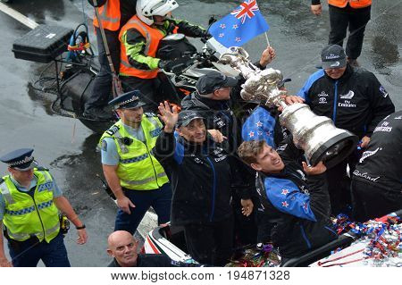 AUCKLAND - JULY 06 2017: Fans welcome home Team New Zealand and the Auld Mug America's Cup Trophy in downtown Auckland New Zealand.