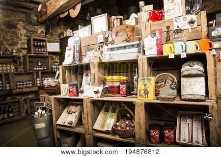 Valognes Normandy France - February 06 2014. Traditional typical delicatessen shop in Normandy. Shop of jams chutney alcohol biscuits pasta beer milk jam and retro products for decoration In wooden boxes