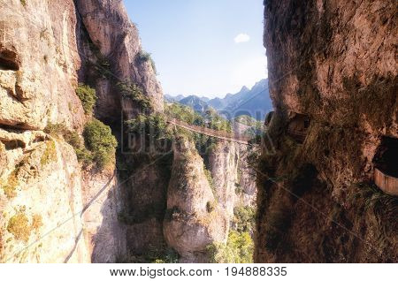 The suspension bridge at Fangdong Scenic Area in Yandangshan mountains located in Zhejiang province China.