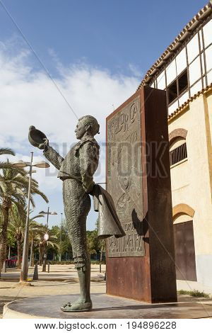 Lorca Spain - May 29 2017: Historic bullfight arena in Lorca with monument to the famous torero Pepin Jimenez. Province of Murcia Spain