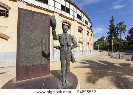 Lorca Spain - May 29 2017: Historic bullfight arena in Lorca with monument to the famous torero Pepin Jimenez. Province of Murcia Spain