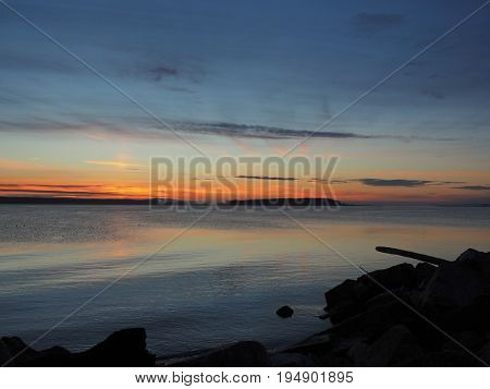 Sunset on the rocky beach in Sidney Vancouver Island British Columbia Canada