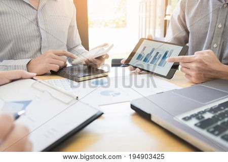 Team Work Process. Young Business Managers Crew Working With New Startup Project. Labtop On Wood Tab