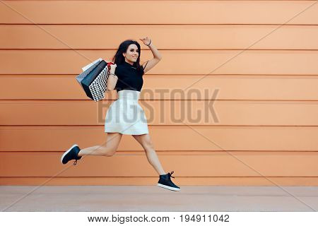Happy Woman Running With Shopping Bags in Summer Sale Season