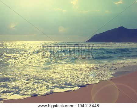 Vacation or travel background with a beautiful beach on summer retro film stylized