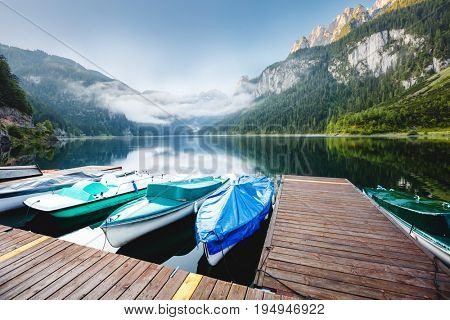Stunning image of alpine lake Vorderer Gosausee. Picturesque and gorgeous morning scene. Salzkammergut is a located in the Gosau Valley in Upper Austria. Dachstein glacier. Explore the world's beauty.