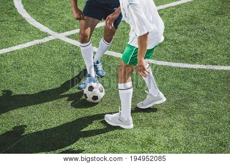 Partial View Of Athletic Soccer Players Playing Soccer On Pitch