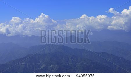 Panoramic view of Himalayan Mountain Range with Blue Sky and Clouds