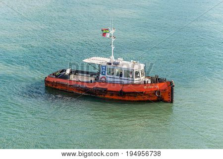 Port Louis Mauritius - December 25 2015: Tugboat Dombeya in Port Louis Mauritius. Port Louis was already in use as a harbor in 1638.
