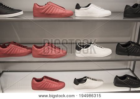 Men's sports shoes on the counter in the store