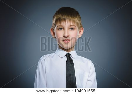 Closeup Portrait of happy boy going surprise isolated on gray background.