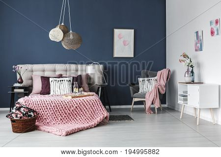 Thick pink blanket on the bed with soft bedheads