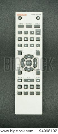 Universal remote control isolated on black background.