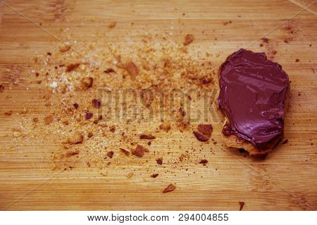 Bread Crumbs Around Chocolate On Toasted Bread, Chocolate Bread On Cutting Board With Breadcrumbs Ar