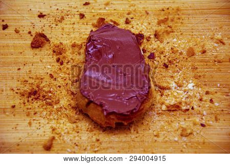 Bread Crumbs Around Chocolate On Toasted Bread, Chocolate Bread On Cutting Board With Breadcrumbs Ar