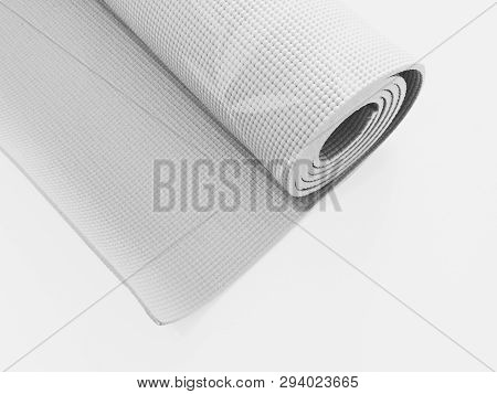 Woman Rolling Her Yoga Mat After A Workout - Top View.equipment For Yoga. Rolled Up Yoga Mat Isolate