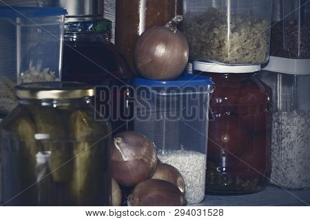 Storage Shelves In Pantry With Homemade Canned Preserved Fruits And Vegetables