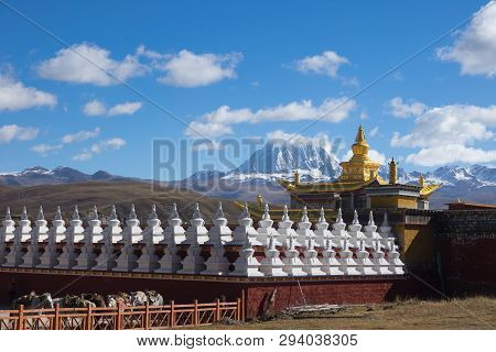 Tagong Temple  And Background Tibetan Holy Mountain Mt. Yala And Sichuan, China.