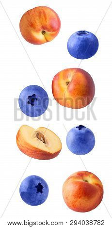 Falling Fresh Berriy And Peaches Isolated On White Background