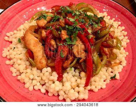 Couscous With Bbq Chicken And Vegetables Served At Restaurant / Kuskus