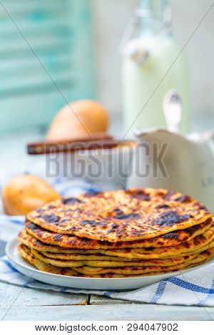 Norwegian Potato Cakes Lefse In A White Plate On A Wooden Table With Linen Cloth, Selective Focus.