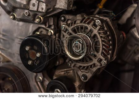 Disassembled Car Dirty Engine And Dynamo At Garage