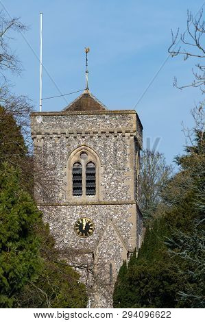 The Clock Tower Of St Peters Church Seen From Across The River Thames In Caversham