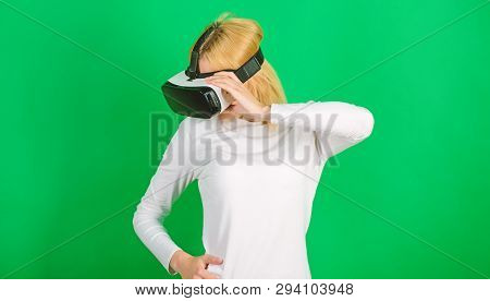 The Woman With Glasses Of Virtual Reality. Woman With Virtual Reality Headset. Funny Woman Experienc