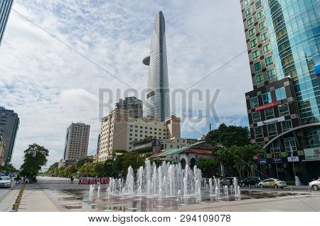 Ho Chi Minh City, Vietnam - August 24, 2017: Fountain On Nguyen Hue Boulevard With Saigon Skydeck To