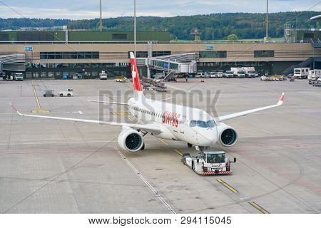 ZURICH, SWITZERLAND - CIRCA OCTOBER, 2018: an Swiss aircraft on pushback at Zurich International Airport.