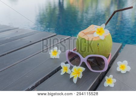 Coconut, Glasses And Hat At The Swimming Pool.summer Concept