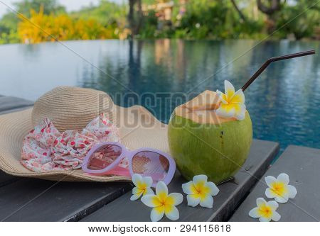 Coconut, Glasses And Hat At The Swimming Pool.summer Concept