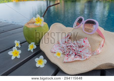 Coconut, Glasses And Hat At The Swimming Pool.summer Concept