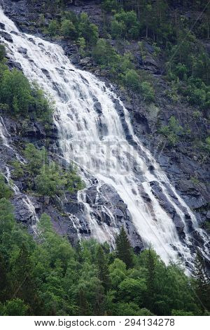 High Waterfall In Mountain Forest Near Rjukan, Hardanfervidda, Norway