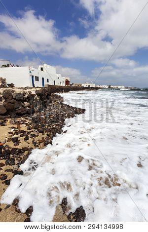 Stones And White Houses At The Coast Of Caleta De Sebo On The Island La Graciosa Of Lanzarote