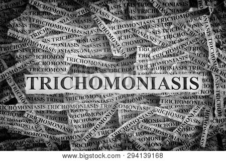 Trichomoniasis. Torn Pieces Of Paper With The Words Trichomoniasis. Concept Image. Black And White. 