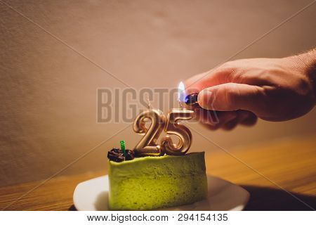 Twenty Five Years Anniversary. Birthday Chocolate Cake With White Burning Candles In The Form Of Num