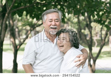 Happy Love Elderly Couple Smile Face , Senior Couple Old Man And Senior Woman Relaxing Hug In A Fore