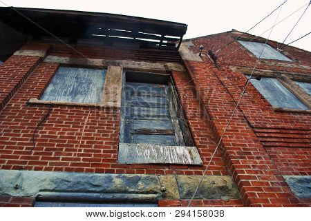 Abandoned Brick Train Depot With Tracks And Graffiti
