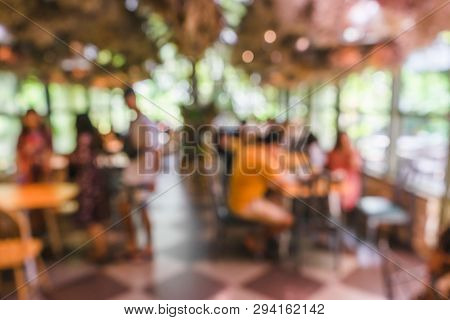 Blurred Green Nautre Coffee Shop Or Cafe Restaurant With Abstract Bokeh Light Background.