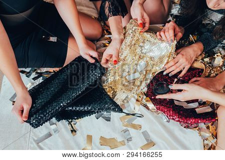Girls Relaxation Time. Glamor Look And Lifestyle Trends. Women In Black Choosing Sequin Outfit. Urba