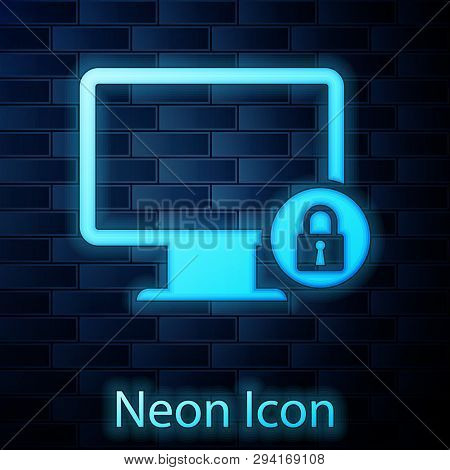 Glowing Neon Lock On Computer Monitor Screen Icon Isolated On Brick Wall Background. Monitor And Pad