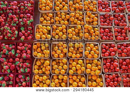 Fresh Boxes Of Assorted Berries On Display At The Farmers Market