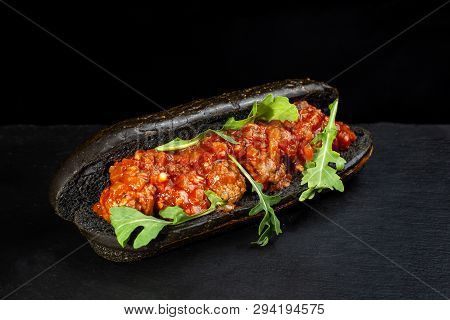 Black Hot Dog Bun With Minced Meat.
