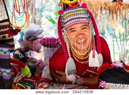 CHIANG MAI THAILAND- FEBRUARY, 2019 : Akha woman selling her goods in Baan Tong Luang eco village near Chiangmai,Thailand. Akha people arrived to Thailand from Myanmar 