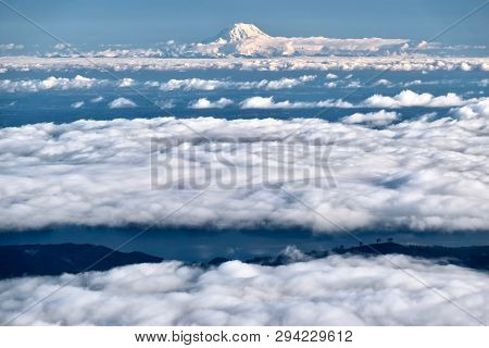 Mount Rainier In Clouds And Seattle. View Form Above. Wa. Usa
