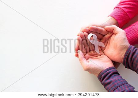 Man And Woman Hold White Ribbon With Copyspace